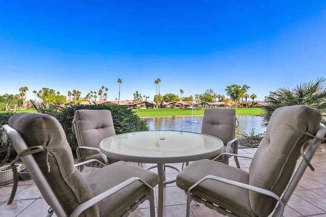 view of patio with a water view