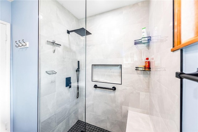 bathroom with a tile shower