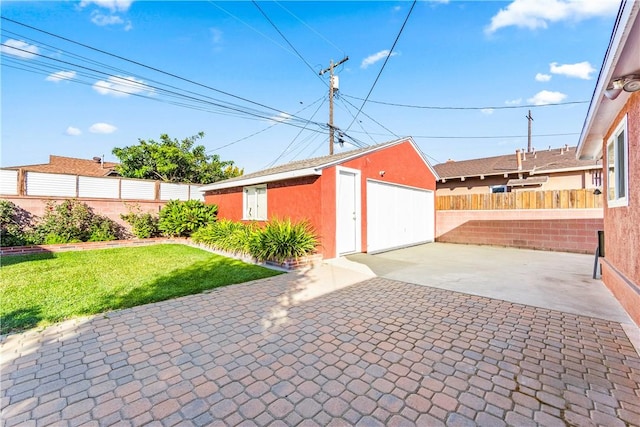 garage with a lawn