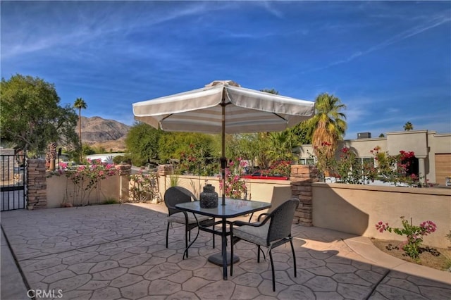 view of patio / terrace with a mountain view