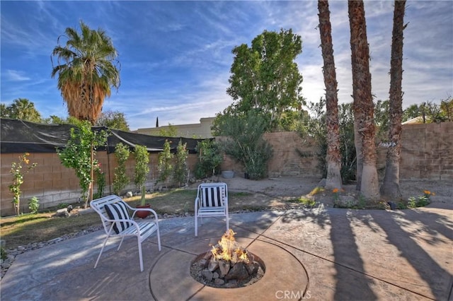 view of patio with an outdoor fire pit