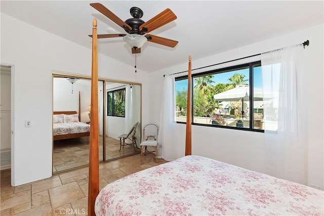 bedroom featuring ceiling fan and vaulted ceiling