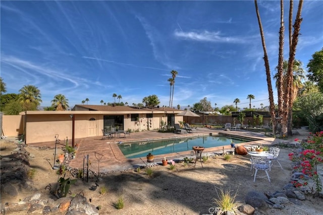 view of swimming pool featuring a patio area