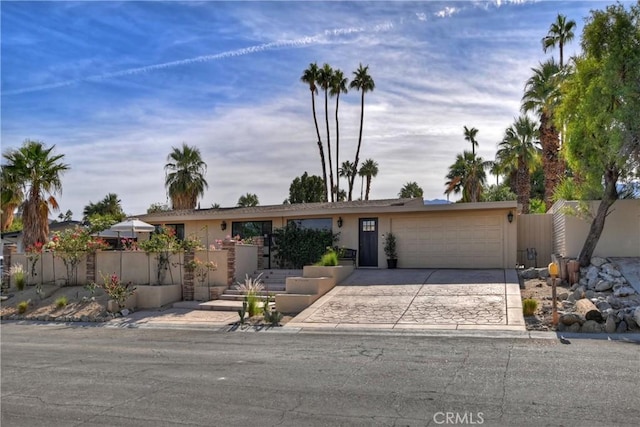 single story home featuring a garage