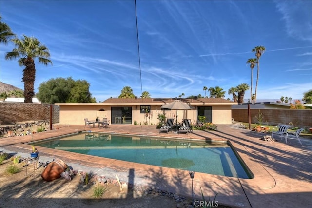 view of swimming pool featuring a patio