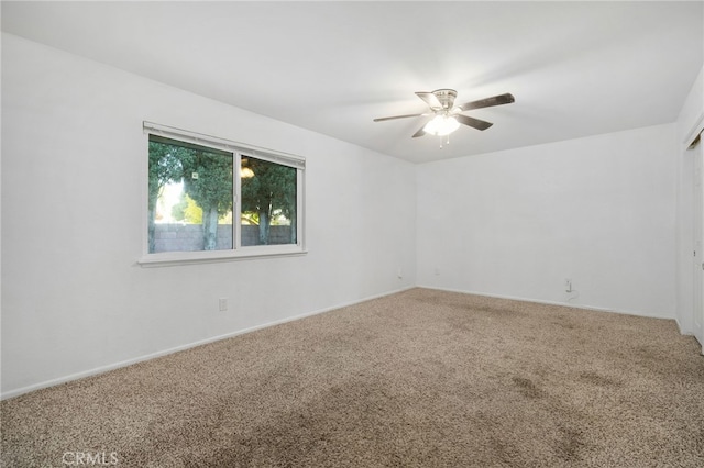 carpeted empty room with ceiling fan