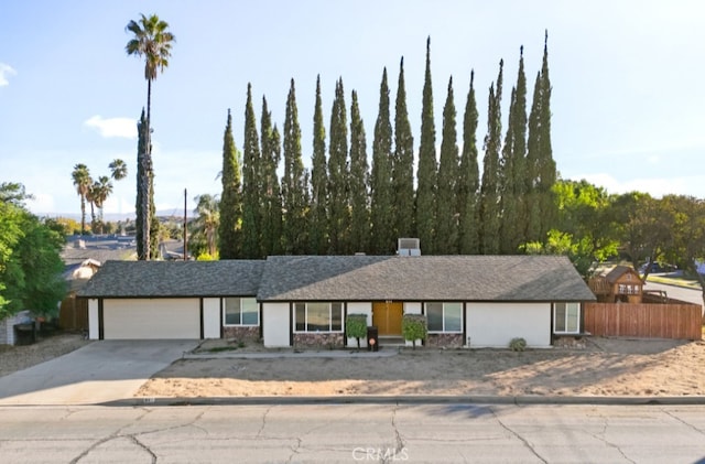 ranch-style home featuring a garage