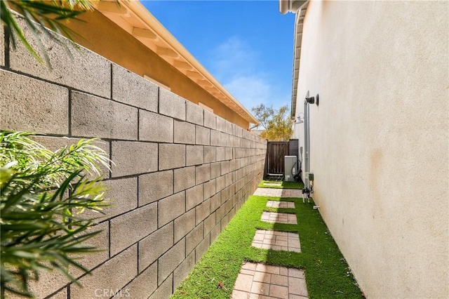 view of home's exterior featuring fence