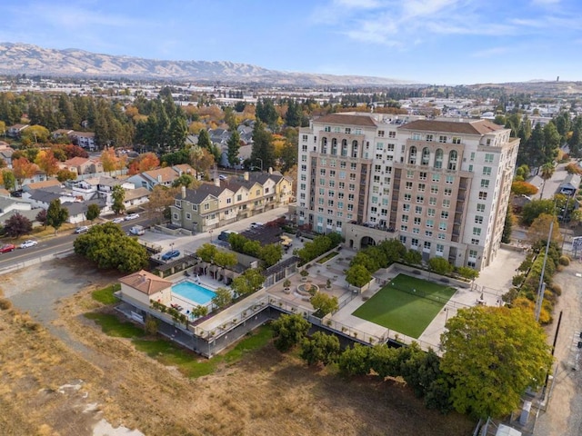 birds eye view of property featuring a mountain view