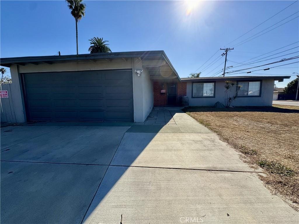 single story home with a garage