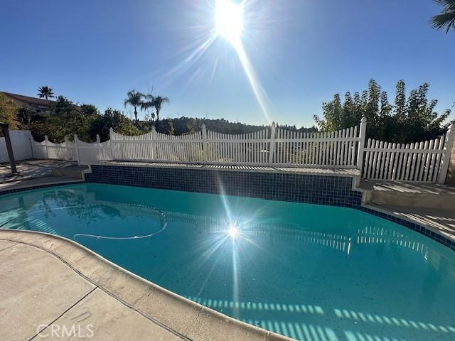 view of pool featuring a fenced in pool, a fenced backyard, and a patio