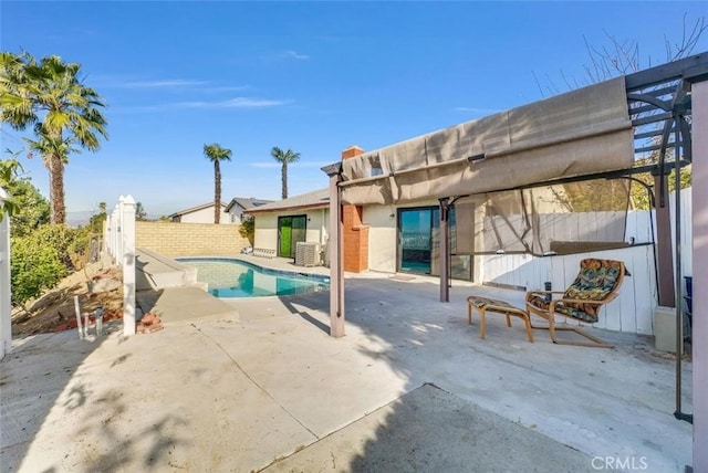view of swimming pool featuring central air condition unit, a patio, fence, and a fenced in pool