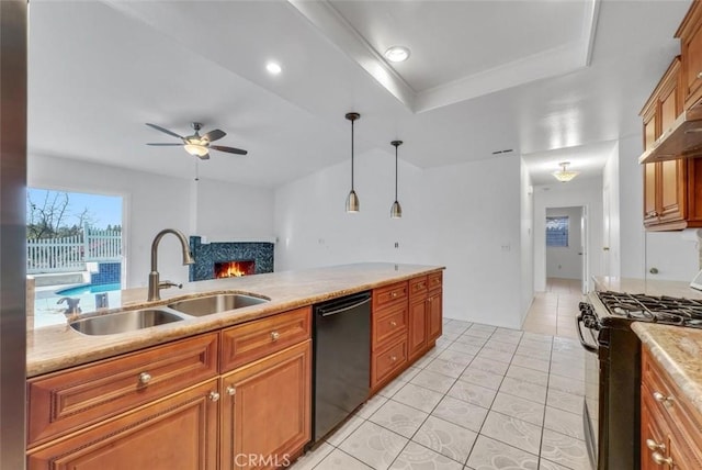 kitchen featuring dishwasher, ceiling fan, sink, decorative light fixtures, and gas stove