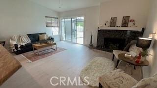 living area with a high end fireplace