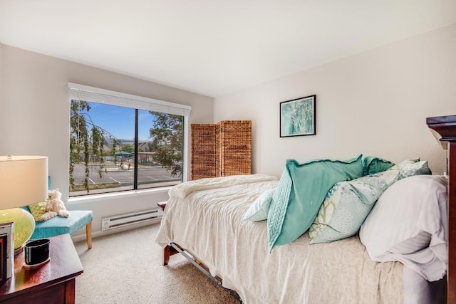 carpeted bedroom featuring a baseboard radiator