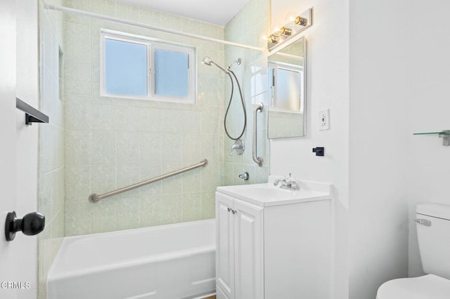 full bathroom with vanity, toilet, and tiled shower / bath combo