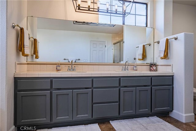 bathroom with vanity and an enclosed shower