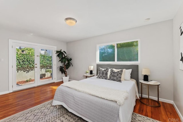 bedroom with access to outside and light hardwood / wood-style floors