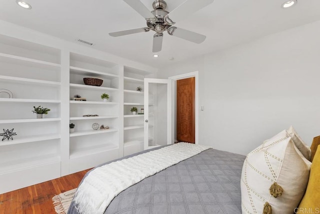 bedroom with wood-type flooring and ceiling fan