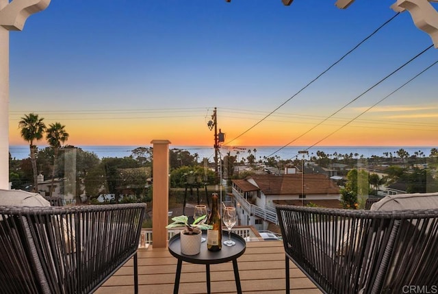 balcony at dusk with a water view