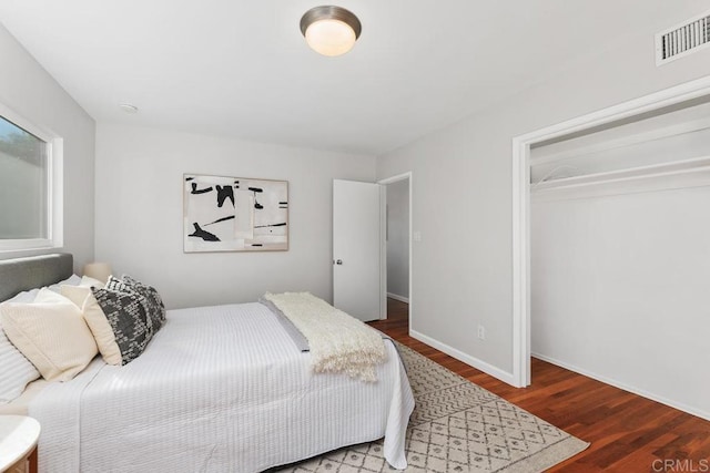 bedroom featuring dark hardwood / wood-style floors