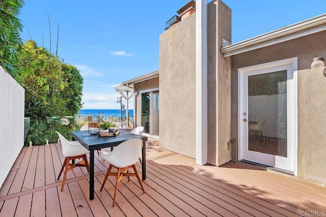 deck featuring a water view