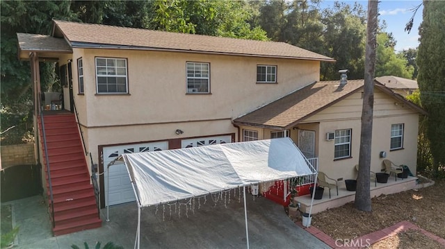 rear view of house featuring a patio