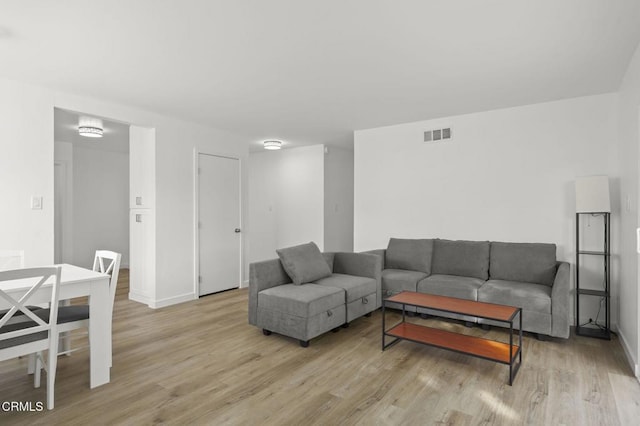 living room with light hardwood / wood-style floors