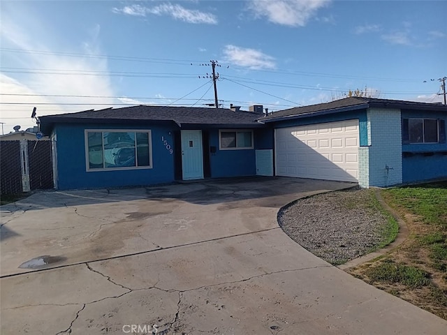 ranch-style home featuring a garage