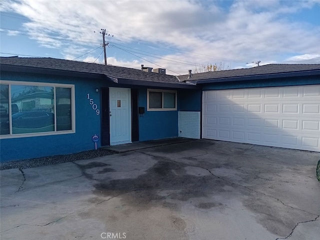 ranch-style home with a garage