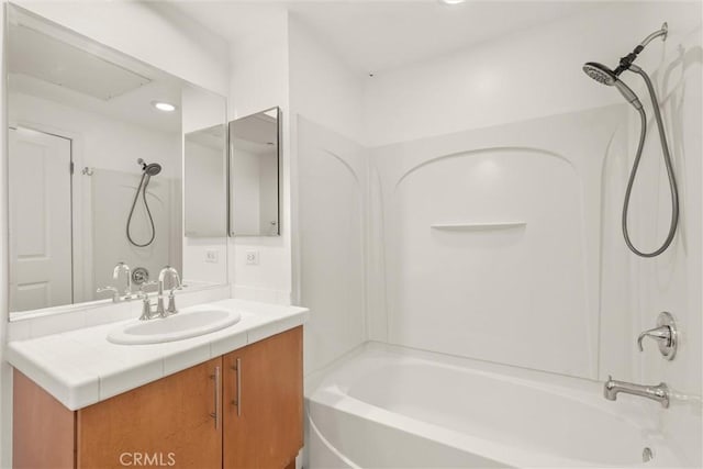 bathroom with vanity and bathtub / shower combination