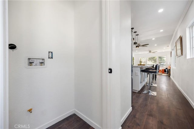 hall featuring dark hardwood / wood-style floors and ornamental molding