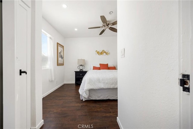 bedroom featuring ceiling fan and dark hardwood / wood-style flooring