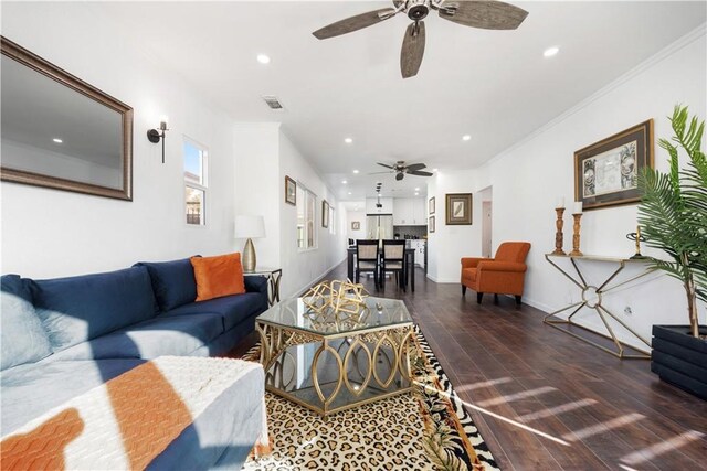 living room featuring dark hardwood / wood-style floors and ornamental molding