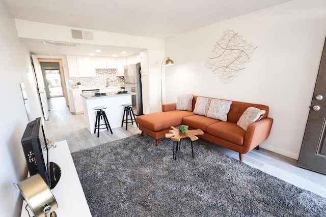 living room with light wood-type flooring