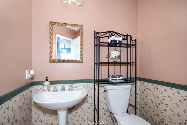 bathroom with toilet and sink