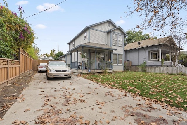 view of front facade with a front yard and a porch