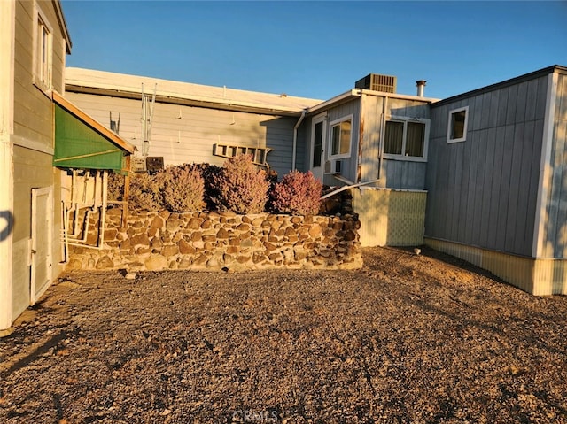 view of home's exterior with central AC unit