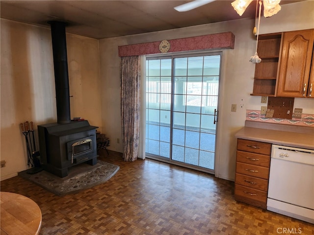 interior space featuring a wood stove and parquet floors