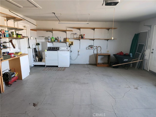 garage featuring a workshop area, a garage door opener, and washing machine and clothes dryer