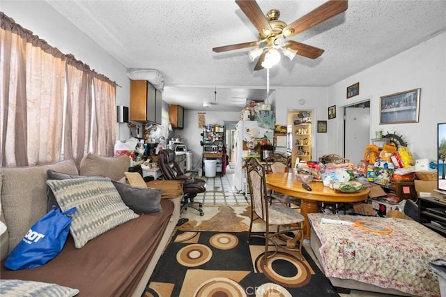 dining room with a textured ceiling and ceiling fan