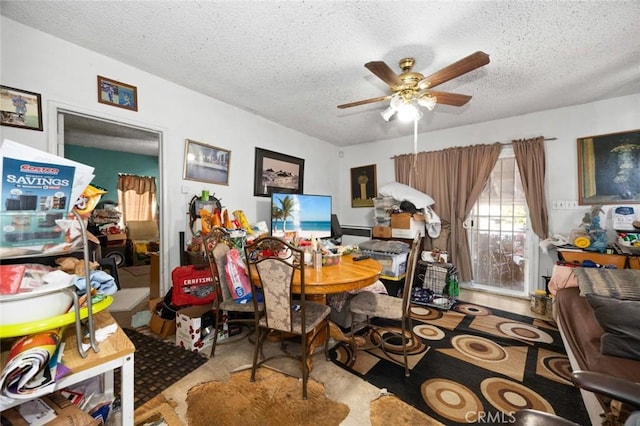 interior space featuring a textured ceiling and ceiling fan