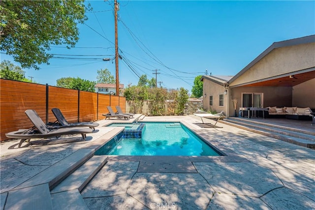 view of pool featuring outdoor lounge area and a patio area