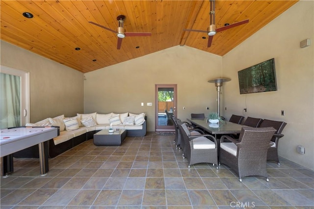 tiled dining area with high vaulted ceiling and wooden ceiling