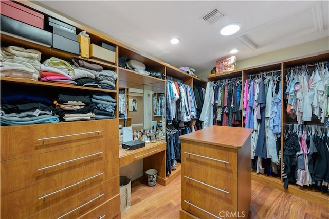 walk in closet featuring light hardwood / wood-style flooring