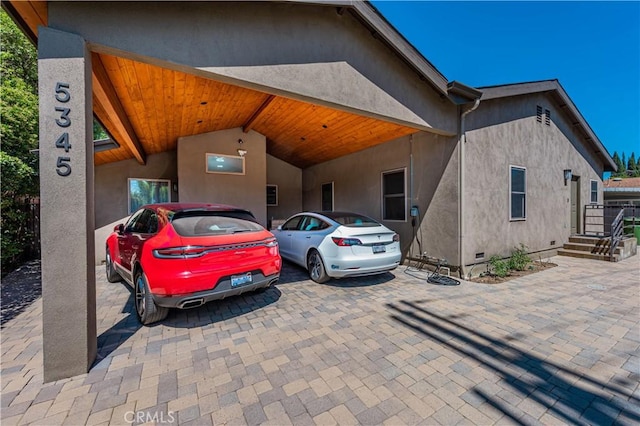 view of front of property featuring a carport