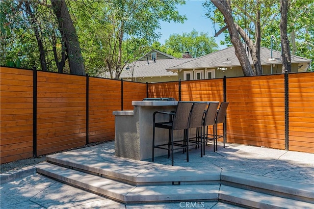 view of patio / terrace featuring exterior bar