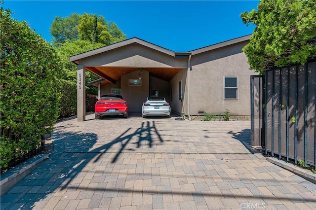 view of front of house with a carport