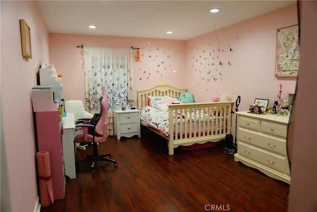 bedroom with dark wood-type flooring