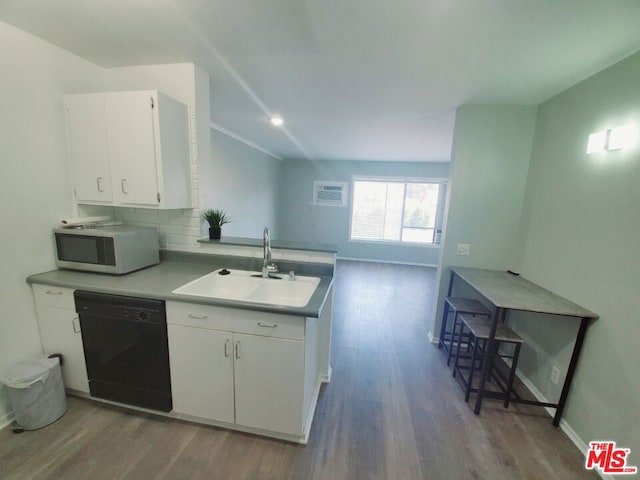 kitchen with white cabinets, dark hardwood / wood-style flooring, black dishwasher, and sink